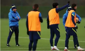  ?? Photograph: Tottenham Hotspur FC/Getty Images ?? Antonio Conte leads a Christmas Eve training session. Spurs are running 15km a game more under Conte than the previous manager, Nuno Espírito Santo.