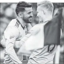  ?? Robert Sabo ?? MARK OF EXCELLENCE: David Villa (left) is all smiles after scoring the 400th goal of his career, the first of his two tallies in NYCFC’s 3-1 win over FC Dallas at Yankee Stadium on Sunday.