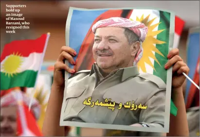  ?? PHOTO: GETTY IMAGES ?? Supporters hold up an image of Masoud Barzani, who resigned this week