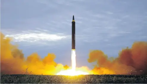  ?? KOREAN CENTRAL NEWS AGENCY / KOREA NEWS SERVICE VIA THE ASSOCIATED PRESS FILES ?? The North Korean government shows what was said to be the test launch of an intermedia­te range missile in August.