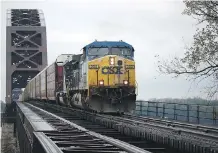  ?? LUKE SHARRETT/BLOOMBERG ?? A CSX train travels through Louisville, Ky. Railway executive Hunter Harrison is expected to be named CSX’s CEO.