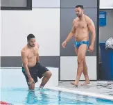  ?? Picture: AAP IMAGES ?? Jarryd Hayne and Ryan James prepare for a dip at training.