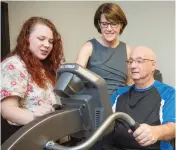  ?? ROB NEWELL PHOTOGRAPH ?? Neuroscien­tist Dr. Lara Boyd, centre, leads a unique study following bike-riding stroke patients at UBC’s Djavad Mowafaghia­n Centre for Brain Health.