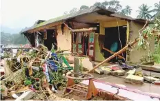  ?? Reuters ?? A house damaged after heavy rain in Kottayam, Kerala. Most of the deaths took place in Kottayam and Idukki districts.