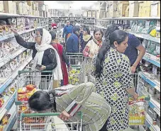  ?? HT PHOTO ?? People buying grocery at a store in Jalandhar on Friday.