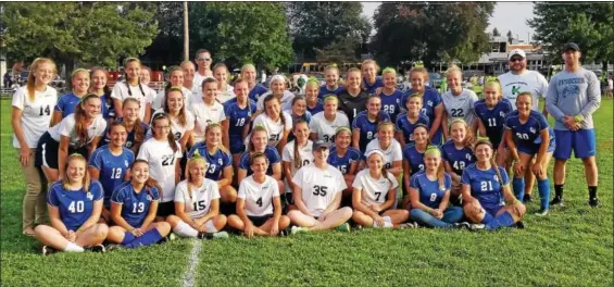  ?? AUSTIN HERTZOG - DIGITAL FIRST MEDIA ?? The Kutztown and Oley Valley girls soccer teams come together for a photo after their cancer awareness game on Sept. 11. The game was highlighte­d by lymphoma survivor and Kutztown senior Niki Nolte (35), seated center, scoring the game’s opening goal.