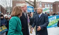  ?? GETTY IMAGES ?? POL TO POL: Ex-Gov. Deval Patrick meets up Tuesday with ex-Gov. William Weld outside a Manchester, N.H., school. After finishing ninth among Democrats, Patrick has dropped out of the race. Weld took 9% of GOP votes in a race dominated by President Trump.