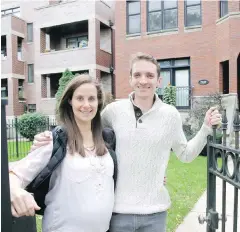  ??  ?? Emily and Brian Townsend in front of the three-flat building in Chicago where they own the top floor unit. The two were surprised by the many unforeseen costs during the buying process.