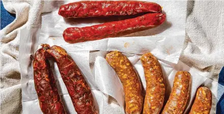  ?? Rey Lopez for the Washington Post/Food styling by Lisa Cherkasky for the Washington Post ?? Among the varieties of chorizo are, clockwise from top, Spanish chorizo, Mexican chorizo and Portuguese chouriço.