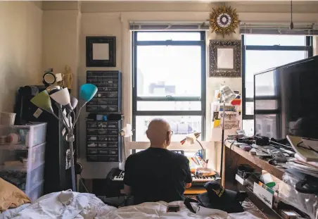  ?? Photos by Jessica Christian / The Chronicle ?? Pobed Lavrentjev, 75, who is studying music, practices on one of four pianos inside his Tenderloin home. He says he doesn’t have time to feel lonely. Many of his peers are not so lucky and are suffering from extreme loneliness during the pandemic shutdown.