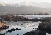  ?? PHOTOS: SUE NOBLEADAMS ?? Natural beauty . . . The Kaikoura Ranges are reflected in a pool of water near the seal colony.