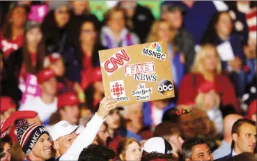  ??  ?? An audience member protests the news media during a President Donald Trump campaign rally in Washington Township Michigan, on April 28 2018. APPaul Sancya