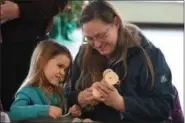  ?? ERIC BONZAR — THE MORNING JOURNAL ?? Emma Verbickey, 4, and her mother, Shannon, of Vermilion, create a cardboard train during Lorain County Metro Parks’ Big Stories Little Actors’ Cultural Arts Program on Dec. 19,