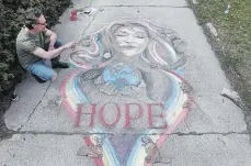  ?? CLIFFORD SKARSTEDT EXAMINER FILE PHOTO ?? Local artist Blake Richardson created inspiring chalk art outside his Herbert Street home earlier in the pandemic in order to give people a smile and a bit of hope.