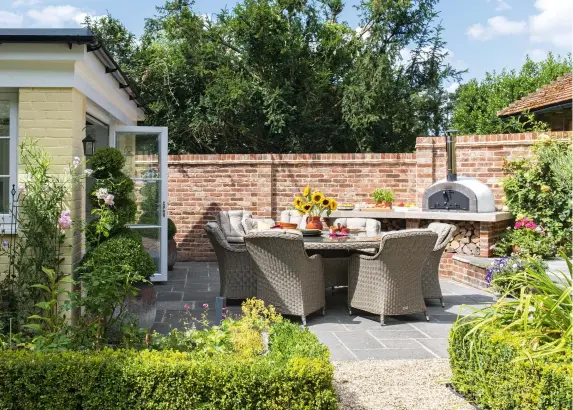  ??  ?? Top: The extension was built over their old patio, but Emma and Guy salvaged the flagstones and relaid them here. The bi-fold doors are from Dale Windows