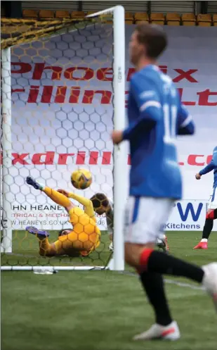  ??  ?? Ianis Hagi slots home Rangers’ third goal of the evening after being picked out by substitute Cedric Itten (left) in the box