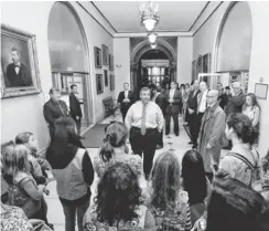  ?? MEL EVANS, AP ?? Republican New Jersey Gov. Chris Christie, center, talks with Girl Scouts touring the Statehouse in Trenton on Nov. 7.