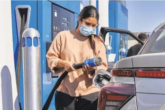  ?? Photos by Philip Cheung / New York Times ?? Hydrogen is used as a fuel in cars, like the Toyota Mirai, above, and heavier vehicles including buses, like those at the Orange County Transit Authority in Santa Ana, left.