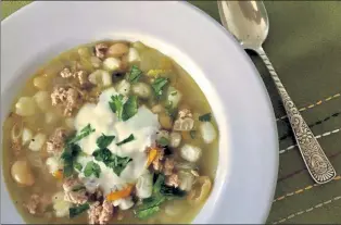  ?? ORANGE COUNTY REGISTER ?? White chili features white beans, such as cannellini, in chicken broth spiked with poblano chilies and topped with a dollop of Greek yogurt.