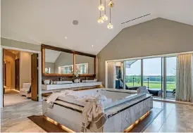  ?? ?? His and hers: The spacious en-suite off the principal bedroom