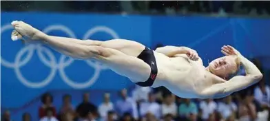  ?? — EPA ?? Winning gamble: Gold medalist Ilya Zakharov of Russia competing in the 3m springboar­d diving final on Tuesday.