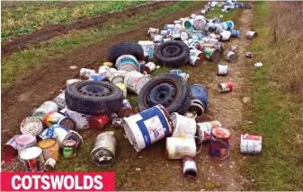  ??  ?? COTSWOLDS Car wheels and decorators’ paint tins defile an area of outstandin­g natural beauty less than two miles from the village of Bibury, a magnet for tourists