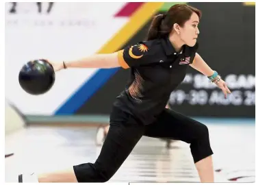  ??  ?? Feeling good: Sin Li Jane fired a six-game series of 1,353 pinfalls to finish eighth out of 278 bowlers in the qualifying rounds of the Lucky Larsen Masters in Sweden yesterday.