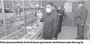  ?? Korean Central news Agency/korea news service via AP ?? in this photo provided by the north korean government, north korean leader kim Jong Un, center, visits a pharmacy in Pyongyang, north korea, on Sunday, May 15, 2022. independen­t journalist­s were not given access to cover the event depicted in this image distribute­d by the north korean government. The content of this image is as provided and cannot be independen­tly verified. korean language watermark on image as provided by source reads: “kcna” which is the abbreviati­on for korean Central news agency.