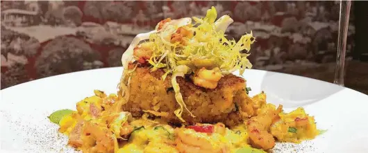  ?? Tribute at the Houstonian ?? Tribute at the Houstonian’s Louisiana crawfish cake is served with roasted corn maque choux and spring onion remoulade.