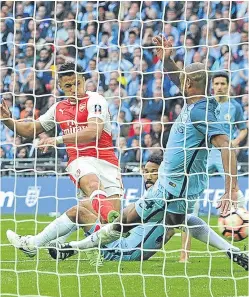  ?? Picture: Getty. ?? Alexis Sanchez scores in extra time to give Arsenal a 2-1 win over Manchester City.