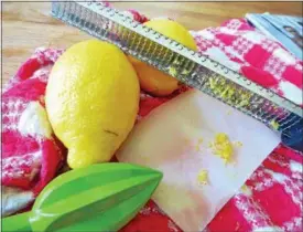  ?? JANET PODOLAK — THE NEWS-HERALD ?? A microplane, used to grate lemon peel into zest, and a reamer are the best tools for making homemade lemonade.