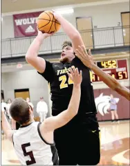  ?? MARK HUMPHREY ENTERPRISE-LEADER ?? Prairie Grove junior center Ryder Orr shoots in the lane over Lincoln’s Kyler Calvin. Orr scored 19 points in the paint to complement Eric Henderson’s 20 mostly on outside shooting as the Tigers beat Lincoln, 66-55, in nonconfere­nce boys basketball action on Dec. 7 at Wolfpack Arena.