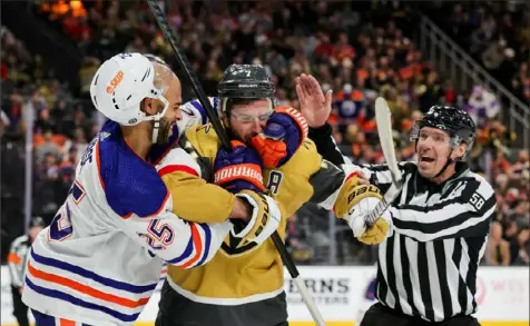  ?? Ethan Miller/Getty Images ?? Edmonton’s Darnell Nurse, left, and Vegas’ Alex Pietrangel­o scuffle in the second period Tuesday in Las Vegas.