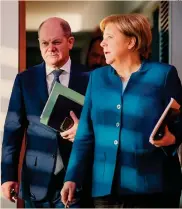  ?? AFP ?? Conti in ordine.Angela Merkel con il ministro delle Finanze Olaf Scholz