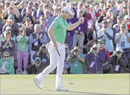  ?? CHARLIE RIEDEL/ASSOCIATED PRESS ?? England’s Danny Willett celebrates on the 18th hole after he birdied three of his last six holes to win the Masters on Sunday at Augusta National.