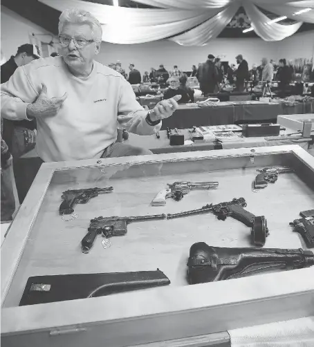  ?? DAN JANISSE ?? Mickey Moulder with his display of vintage guns was one of the exhibitors at the Military, Hunting and Sportsman Show was held Sunday at the Canadian Transporta­tion Museum &amp; Heritage Village in Essex.