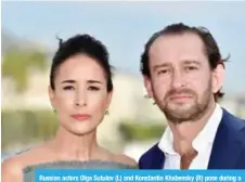  ??  ?? Russian actors Olga Sutulov (L) and Konstantin Khabensky (R) pose during a photocall for the TV drama drama dedicated to Trotsky during the MIPCOM trade show in Cannes.