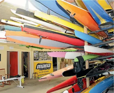  ?? KRIS DANDO ?? It’s a tight squeeze in Mana Kayak Racing Club’s room at the Porirua Rowing Club at Onepoto.