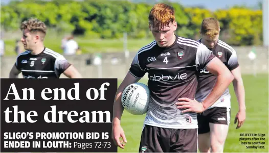  ??  ?? DEJECTED: Sligo players after the loss to Louth on Sunday last.