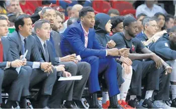  ?? WILFREDO LEE/AP ?? Center Hassan Whiteside, center, has been out with a bone bruise on his knee and he is unlikely for Monday’s game.