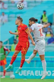  ?? AP ?? Connor Roberts (left) of Wales and Switzerlan­d’s Ricardo Rodriguez vie for the ball during their Euro Group ‘A’ match at the Baku Olympic stadium in Baku, Azerbaijan, on Saturday. —