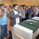  ?? DAVID J. PHILLIP/AP ?? Mourners gather for the funeral of student Sabika Sheikh at the Brand Lane Islamic Center.