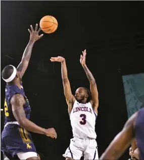  ?? BILL RUDICK - FOR MEDIANEWS GROUP ?? Lincoln’s Reggie Hudson shoots over a Johnson C. Smith defender during their first-round contest at the CIAA Tournament in Baltimore on Wednesday morning.