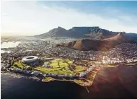  ??  ?? Aerial view of Cape Town with Cape Town Stadium, Lion’s Head and the lovely Table Mountain.