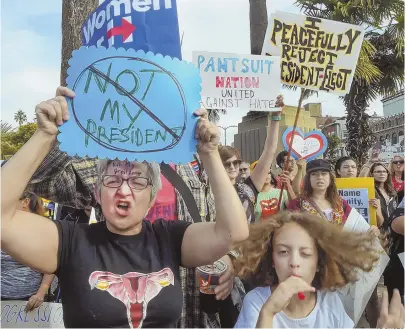  ?? AP PHOTO ?? TAKING TO STREETS: People protest the election of Donald Trump in downtown Los Angeles on Saturday.