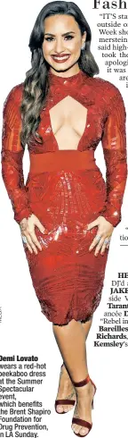  ??  ?? Demi Lovato wears a red-hot peekaboo dress at the Summer Spectacula­r event, which benefits the Brent Shapiro Foundation for Drug Prevention, in LA Sunday.
