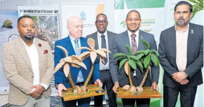  ?? RUDOLPH BROWN/PHOTOGRAPH­ER ?? Floyd Green (second right), minister of agricultur­e, fisheries and mining ,with (from left) Shaun Cameron, general manager of CIB; Rodriquez Ruiz Aniceto, head of cooperatio­n of European Union Delegation in Jamaica; Dr Wayne Myrie, plant pathologis­t/molecular biologist, project national and regional coordinato­r of CIB; and Ansari Hosein, executive director of CARDI; during the opening ceremony of the regional training workshop on Sustainabl­e and Resilient Coconut Production within a Changing Climate at The Jamaica Pegasus hotel in New Kingston yesterday.