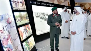  ?? Wam ?? Sheikh Mohammed being briefed about the exhibits at the Etihad Museum on Thursday. —