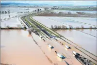  ?? PICTURE: AP ?? Flood water crosses over the Interstate 5 freeway, backing up traffic in both north and southbound lanes for hours in California.