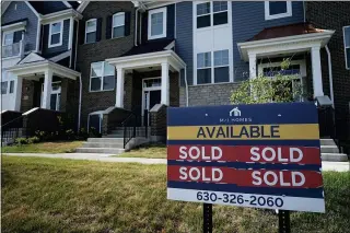  ?? NAM Y. HUH — THE ASSOCIATED PRESS ?? A new home constructi­on site in Northbrook, Ill. More Americans signed contracts to buy homes in May, a surprising rebound after months of cooling in the housing market, where lack of inventory has pushed prices to record levels.